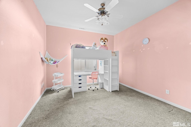 unfurnished bedroom featuring carpet flooring and ceiling fan