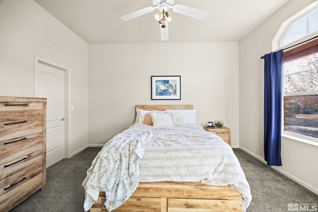 bedroom featuring ceiling fan and dark carpet