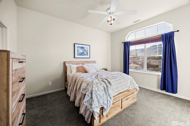 bedroom with dark carpet and ceiling fan