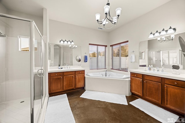 bathroom featuring vanity, separate shower and tub, and an inviting chandelier