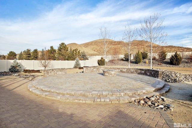 view of patio / terrace featuring a mountain view