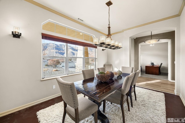 dining room featuring dark hardwood / wood-style flooring and crown molding