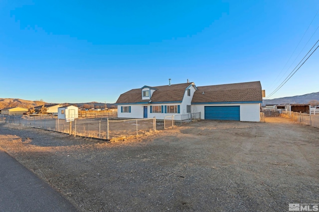 view of front of home with a mountain view