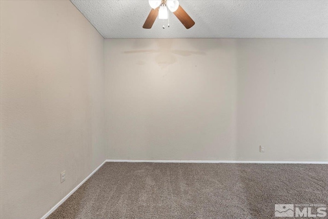 spare room with ceiling fan, carpet, and a textured ceiling