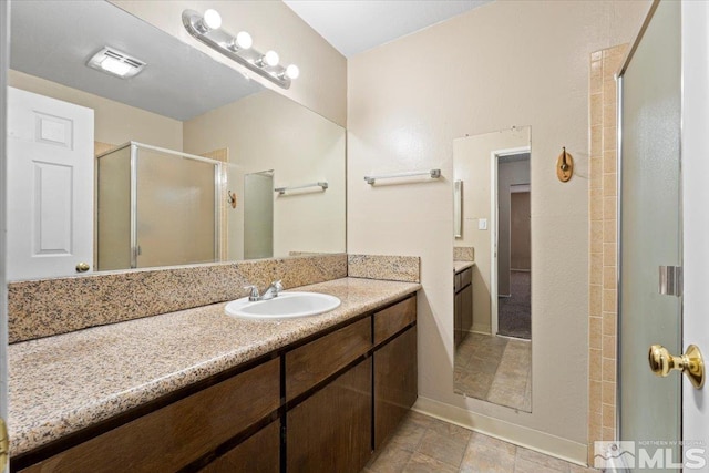 bathroom featuring vanity and walk in shower