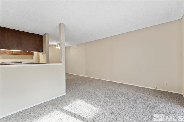 unfurnished living room featuring carpet flooring