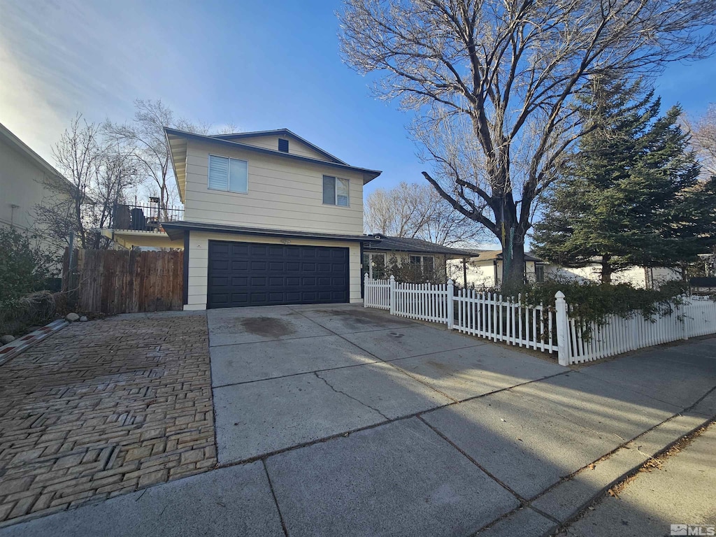 front of property with a garage