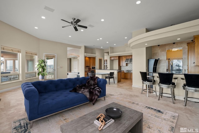 living room with plenty of natural light and ceiling fan