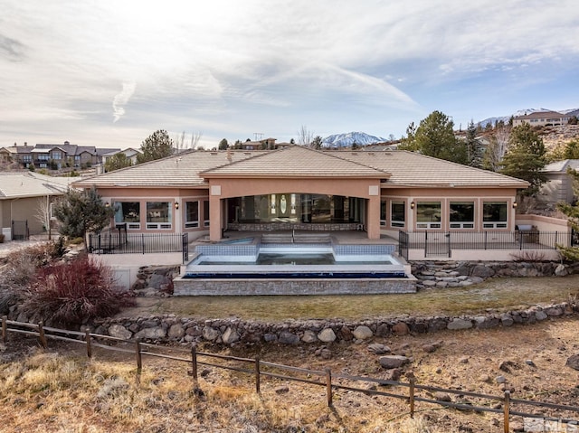 rear view of house with a patio