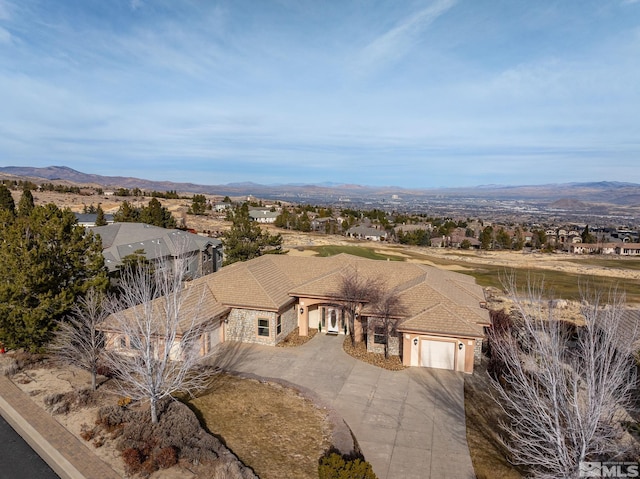 birds eye view of property featuring a mountain view