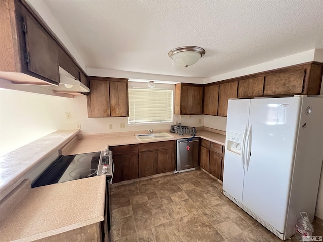 kitchen with dishwasher, dark brown cabinets, and white refrigerator with ice dispenser