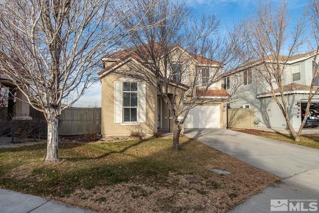 view of front of home with a garage and a front yard