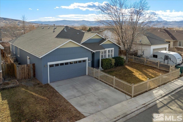 ranch-style home featuring a mountain view and a garage