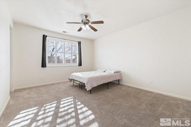 bedroom featuring light colored carpet and ceiling fan