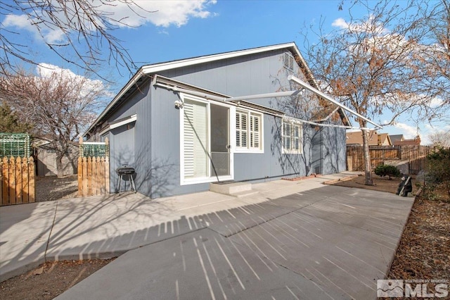 back of house with a patio area