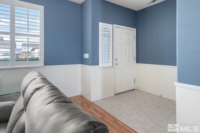 entrance foyer featuring light hardwood / wood-style floors and a wealth of natural light