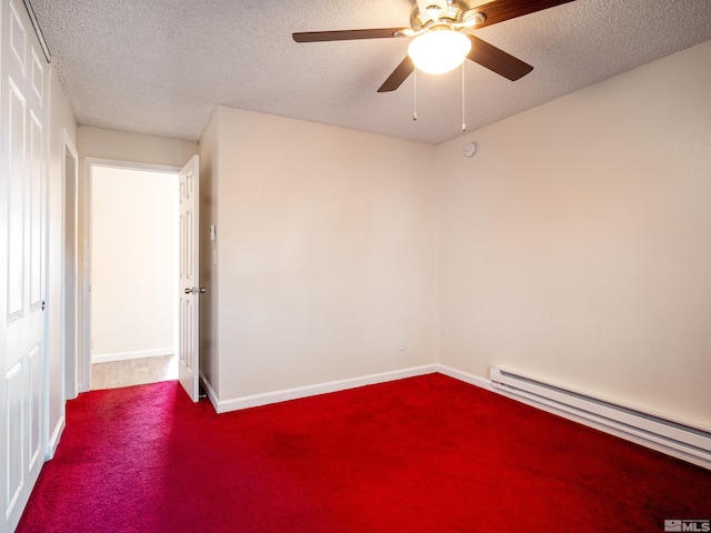 carpeted empty room with ceiling fan, a textured ceiling, and a baseboard radiator