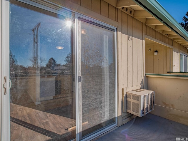 entrance to property featuring cooling unit