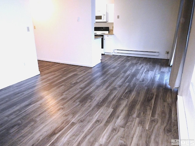 unfurnished living room with dark hardwood / wood-style flooring and baseboard heating