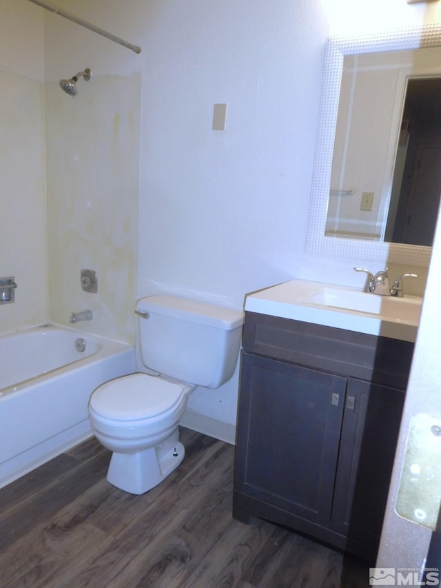 full bathroom with vanity, wood-type flooring,  shower combination, and toilet