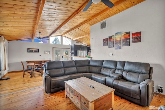 living room with french doors, vaulted ceiling with beams, light hardwood / wood-style flooring, and ceiling fan