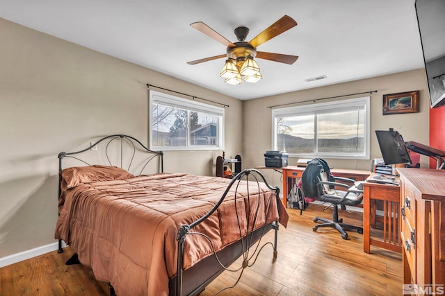 bedroom featuring light hardwood / wood-style flooring and ceiling fan