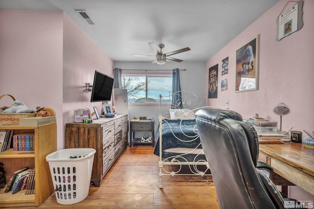 bedroom featuring ceiling fan and light wood-type flooring