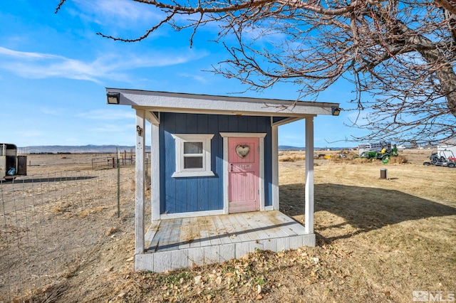 view of outdoor structure featuring a rural view