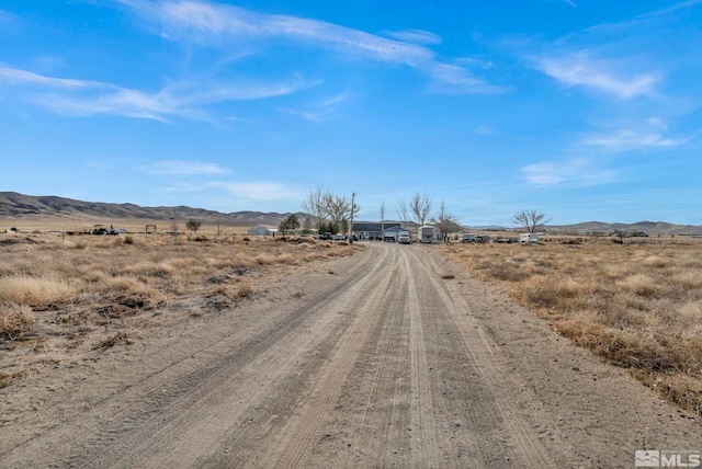 view of street featuring a mountain view and a rural view