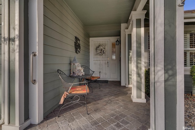 entrance to property featuring a porch