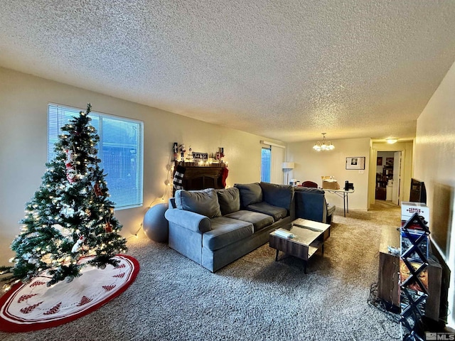 carpeted living room with a textured ceiling and an inviting chandelier