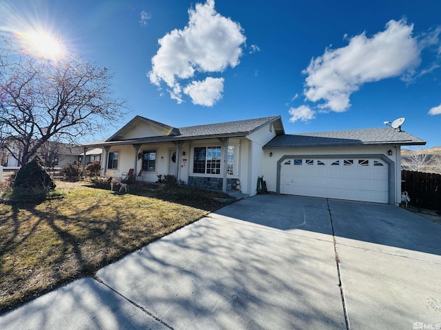 single story home with covered porch and a garage