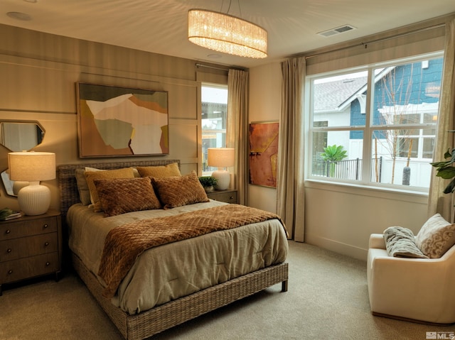 bedroom featuring carpet and visible vents