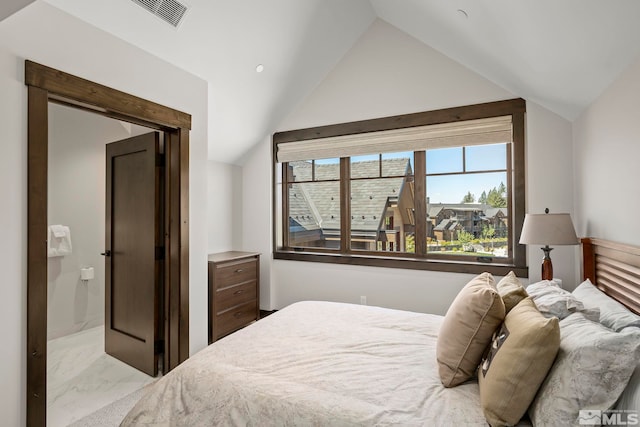 bedroom featuring lofted ceiling