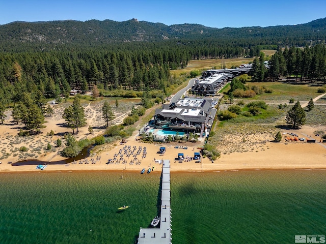 birds eye view of property featuring a water and mountain view