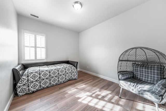 bedroom with hardwood / wood-style flooring