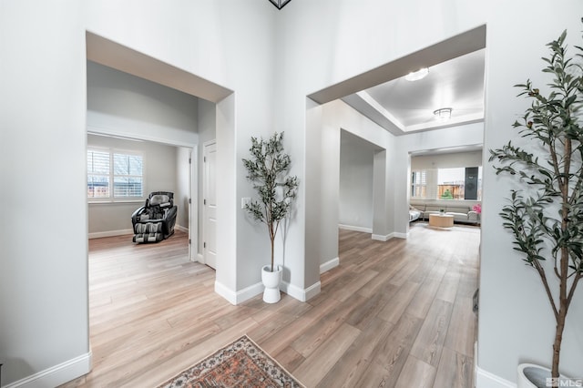 hallway with light hardwood / wood-style flooring