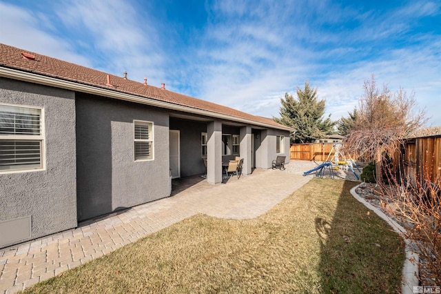 exterior space featuring a yard and a patio