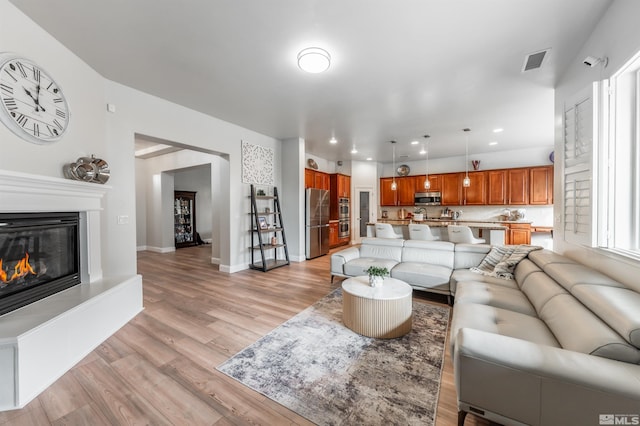 living room with light hardwood / wood-style floors