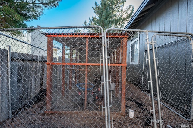 view of gate with fence