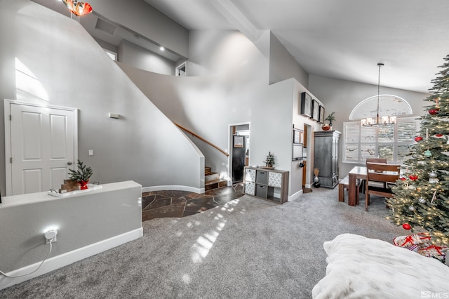 living room featuring baseboards, stairway, an inviting chandelier, carpet floors, and high vaulted ceiling