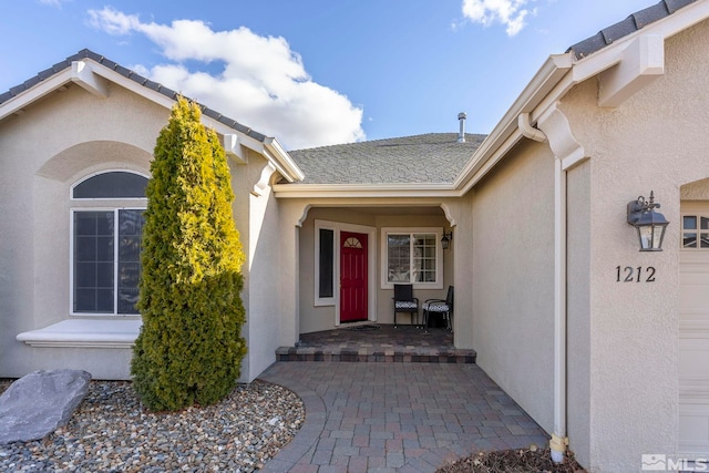 doorway to property featuring a garage