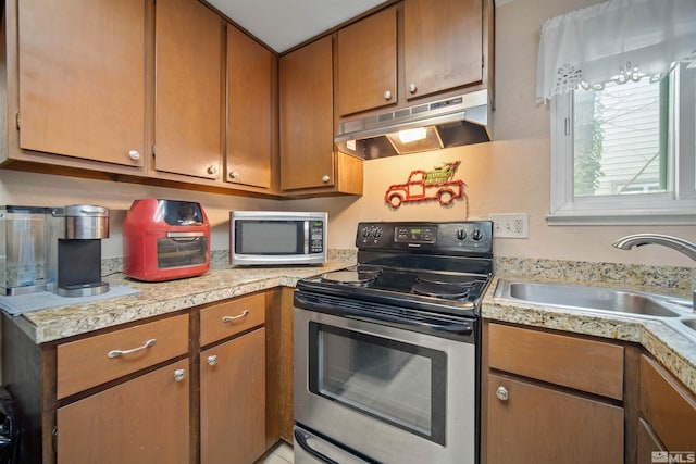 kitchen featuring appliances with stainless steel finishes and sink