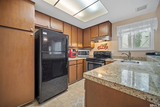 kitchen with light tile patterned flooring, sink, and stainless steel appliances