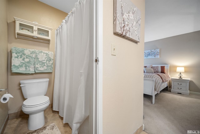 bathroom with tile patterned floors and toilet