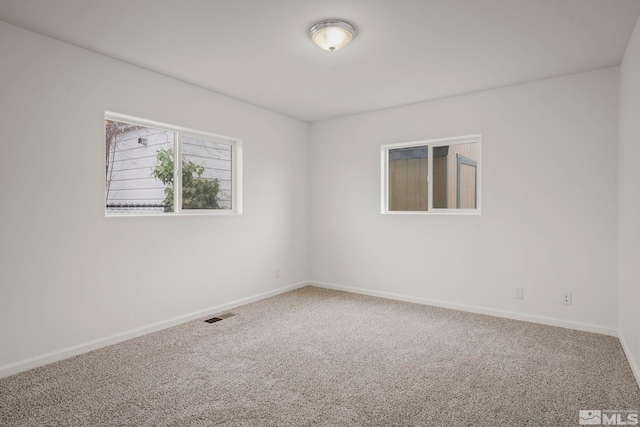 unfurnished room with carpet floors