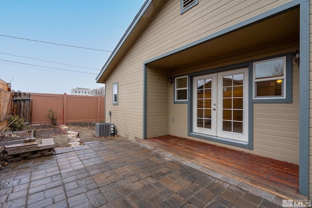 view of patio with central AC unit and french doors