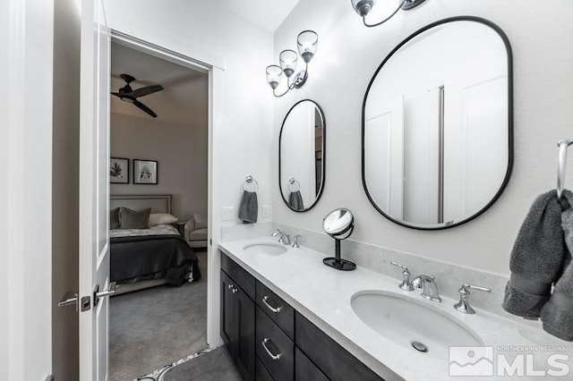 bathroom with ceiling fan and vanity