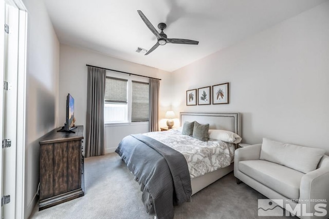 carpeted bedroom featuring ceiling fan