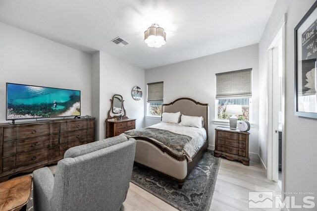 bedroom featuring light hardwood / wood-style floors